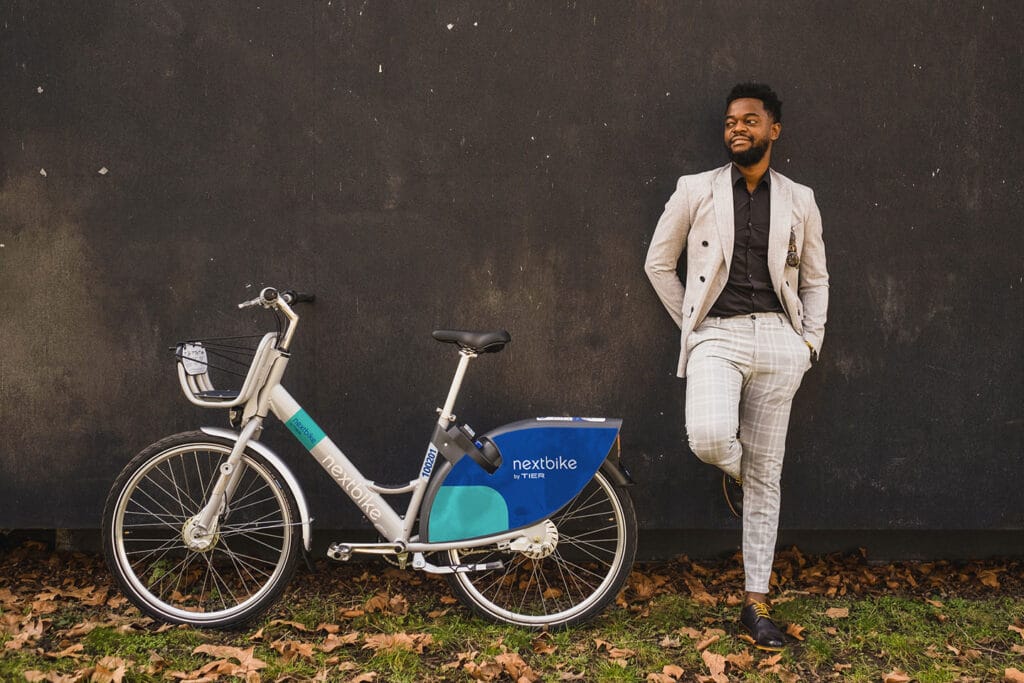young businessman using bike sharing service